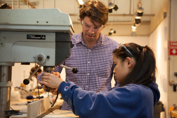 Assistant Professor Kelly Goff assisting student