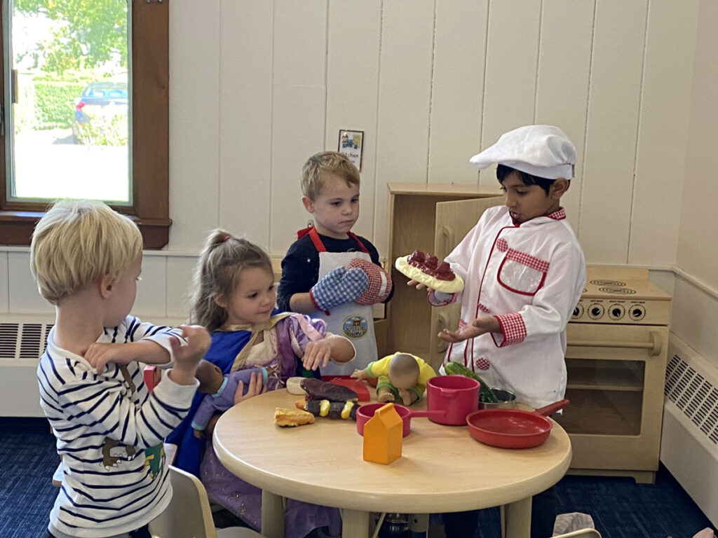 Children playing with cooking toys