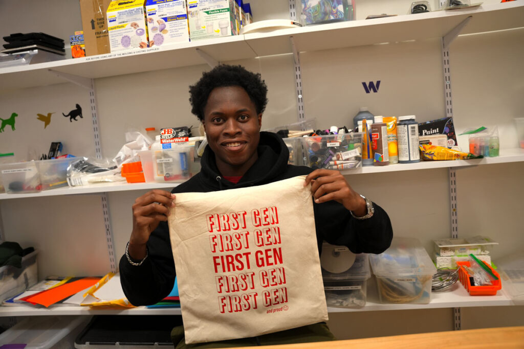 Student holding First Gen bag